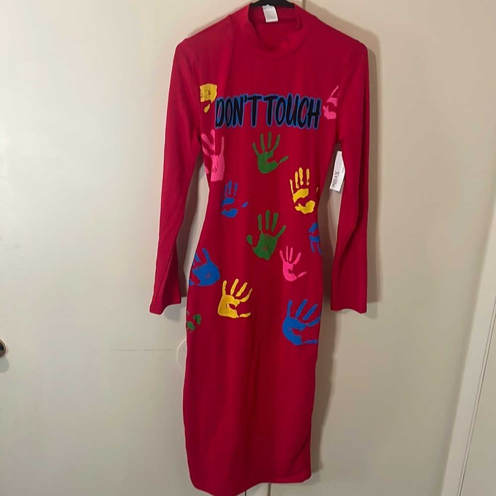 Long sleeve Dress with open back. NWT